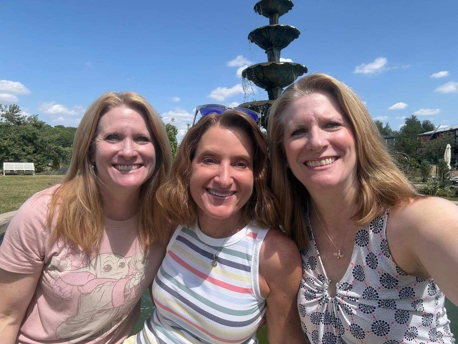Here we see Nicole in the middle of the twins—Jennifer and Lori. Great smiles all!